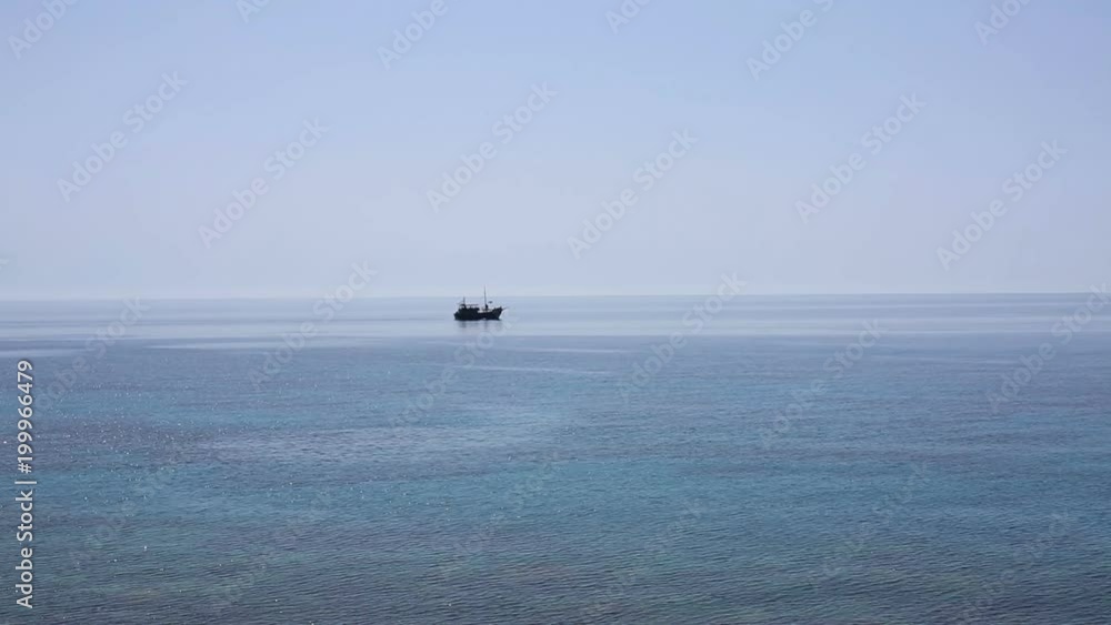 Sailing ship passes the beautiful bay in the sea Sailing ship passes the beautiful bay in the sea