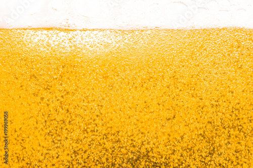 Tableau sur toile Abstract  gold color beer drink background, with white foaming buble texture, al