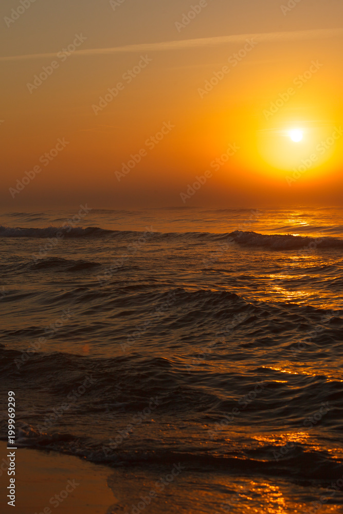 Beatiful red sunset over sea surface