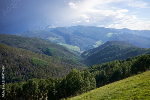 Green forested valley in Colorado during summer © Colby