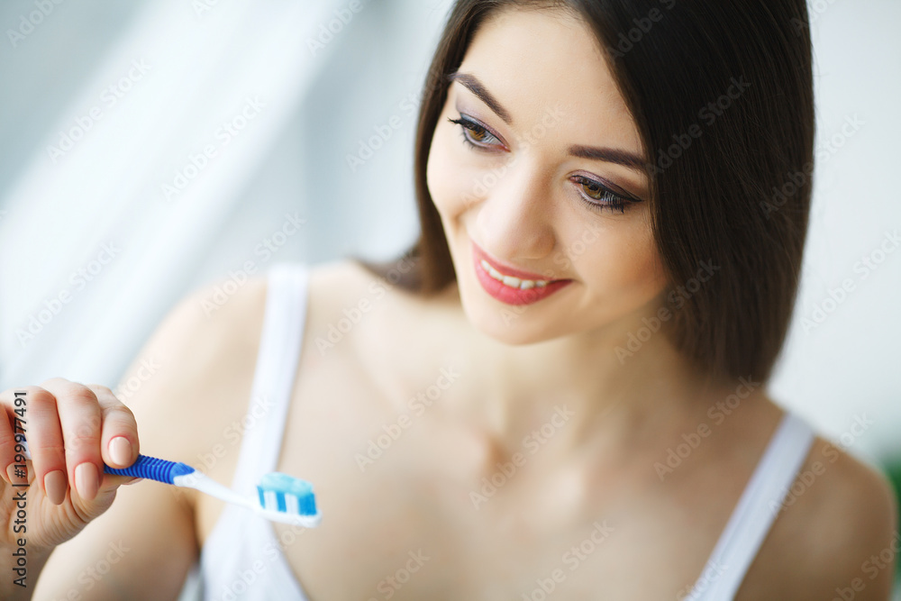 Woman With Beautiful Smile, Healthy White Teeth With Toothbrush. High Resolution Image Woman With Beautiful Smile, Healthy White Teeth With Toothbrush. High Resolution Image
