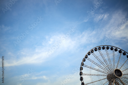 Ferris wheel against blue sky