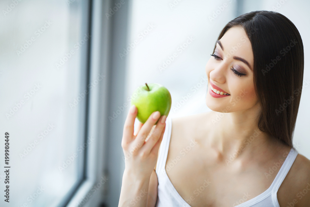 Woman With Apple. Beautiful Girl With White Smile, Healthy Teeth. High Resolution Image Woman With Apple. Beautiful Girl With White Smile, Healthy Teeth. High Resolution Image