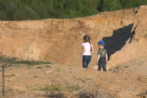 boy and girl in sand quarry