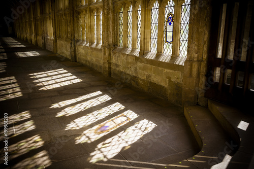 Sun streams through cloisters in Wells cathedral photo
