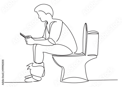 the man is sitting on the toilet with a tablet
