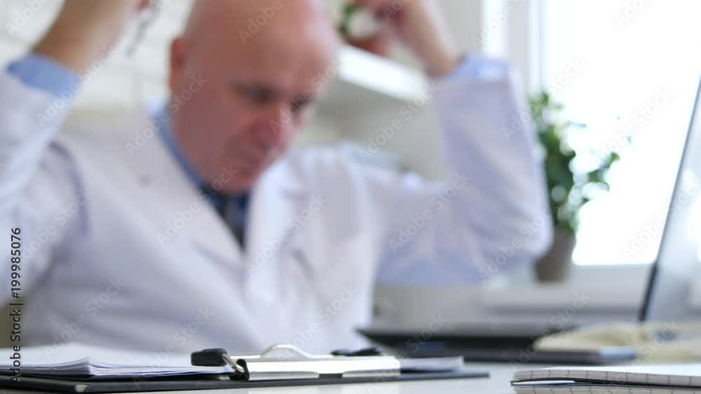 Tired Doctor Finishing Working Program Take Out His Stethoscope in Blurred Image Tired Doctor Finishing Working Program Take Out His Stethoscope in Blurred Image