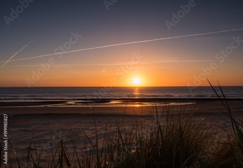 Sun sets over the island of Ameland, Holland