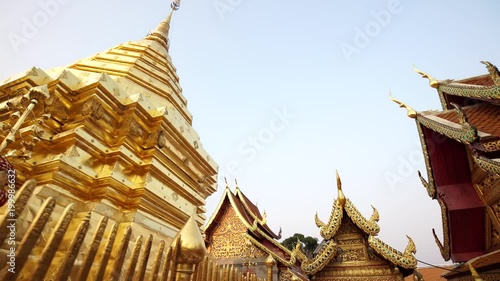 Pano of amaznig golden buddhist stupa at Wat Phra That Doi Suthep. Famous Temple of Chiang Mai, Thailand. Dolly shot photo