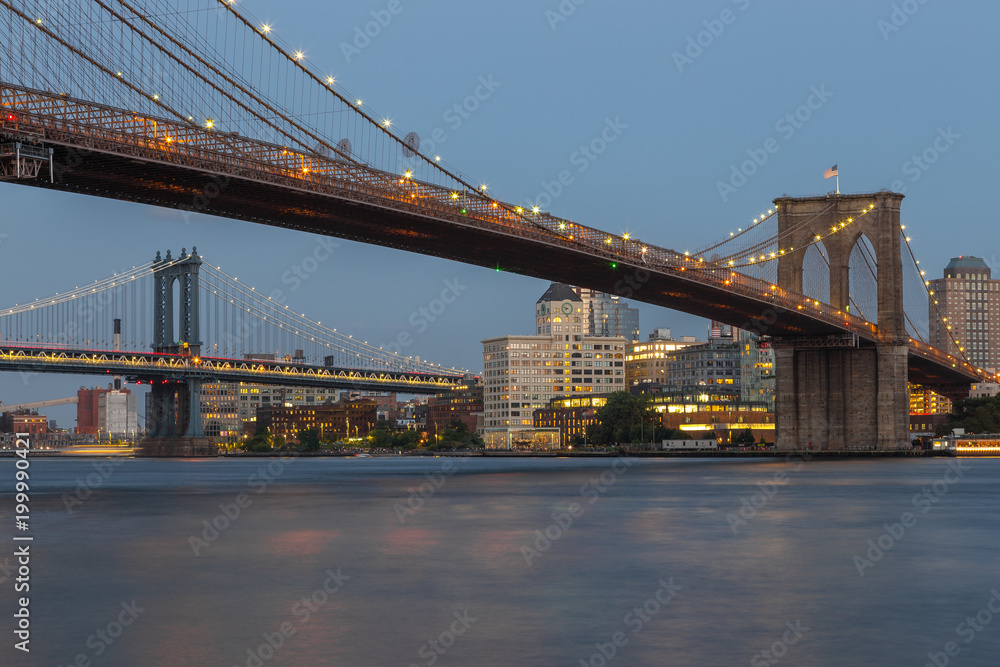 Naklejka premium Sunset view of Manhattan Bridge and Brooklyn Bridge, New York