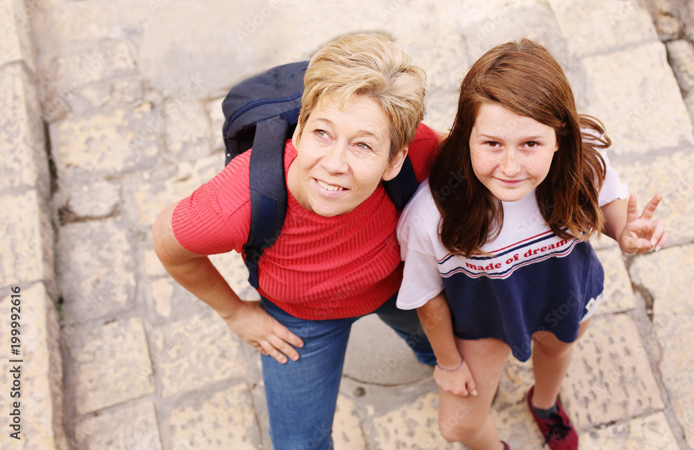 Mature mother traveling with her teen daughter Mature mother traveling with her teen daughter