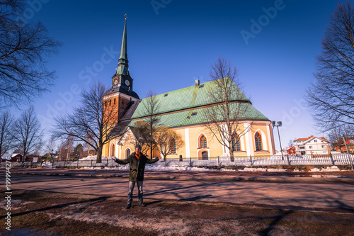 Mora - March 30, 2018: Traveler at the church of the town of Mora in Dalarna, Sweden