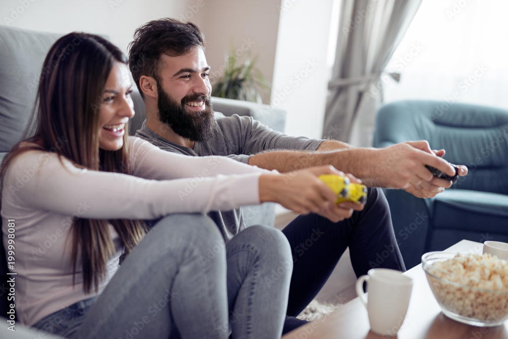 Couple playing video games Couple playing video games