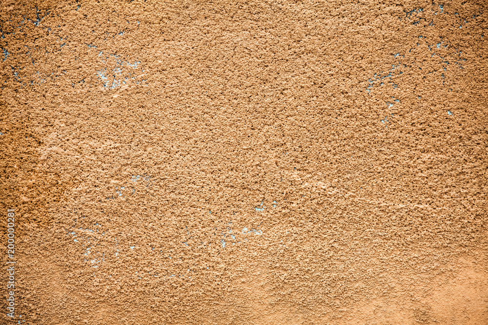 Concrete wall in brown plaster.Colorful parget wall background, stucco orange pattern Concrete wall in brown plaster.Colorful parget wall background, stucco orange pattern