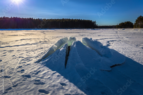 Falun - March 31, 2018: Ice formation at the frozen lake of Framby Udde near the town of Falun in Dalarna, Sweden
