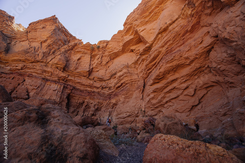 Way to Red canyon  in the Israil in sunny day with red mountains and dry waterfull © Yauhenia