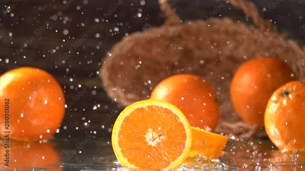 Orange half splashing , slow motion Orange half splashing , slow motion