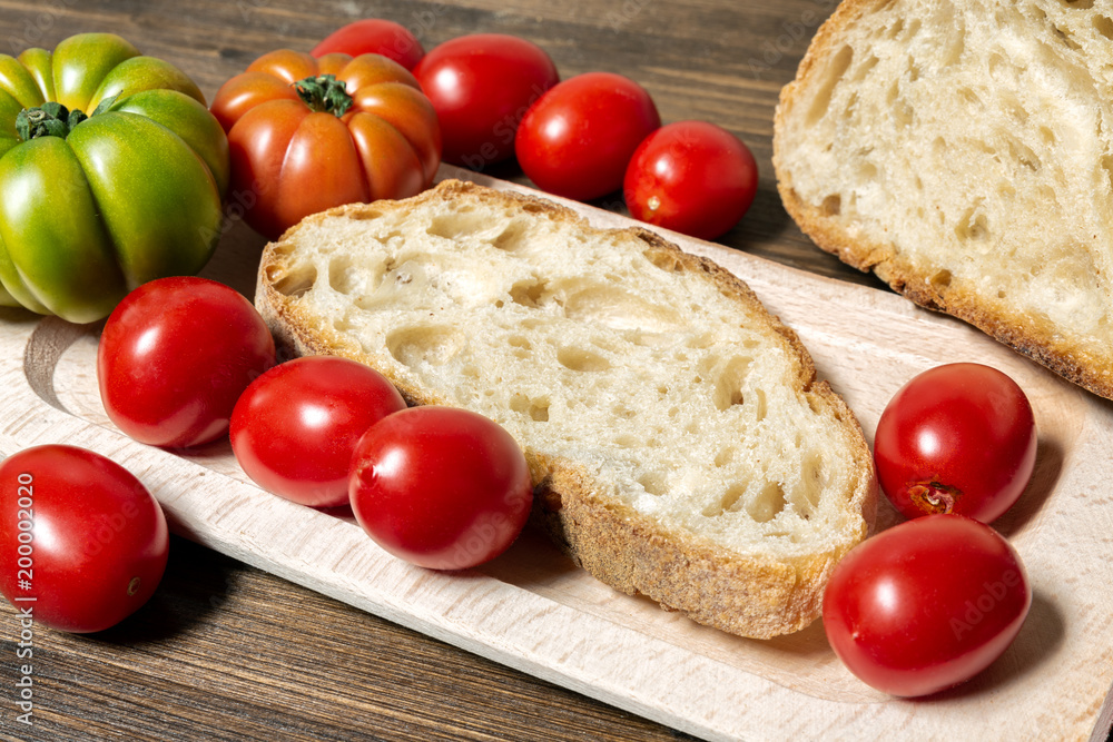 A classic and healthy combination: bread and tomato have a fundamental part in the Mediterranean diet. The tomato is native to the area of Central America. A classic and healthy combination: bread and tomato have a fundamental part in the Mediterranean diet. The tomato is native to the area of Central America.