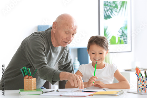 Senior man with his grandda...