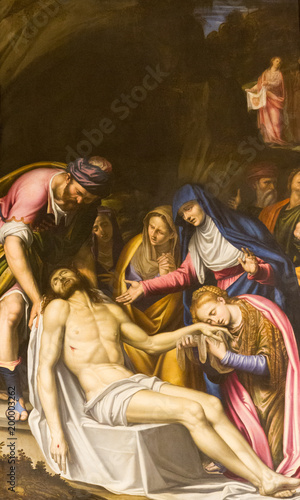 Milano (Milan), Italy. November 25 2017. Dead body of Jesus Christ is being shrouded and put into grave while mourned by the Blessed Virgin, Mary Magdalene and others. San Fedele church in Milan.