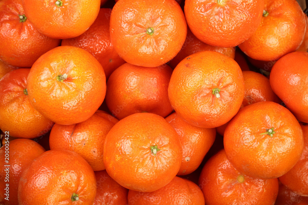 Mandarin, tangerines in the market as a background close-up Mandarin, tangerines in the market as a background close-up