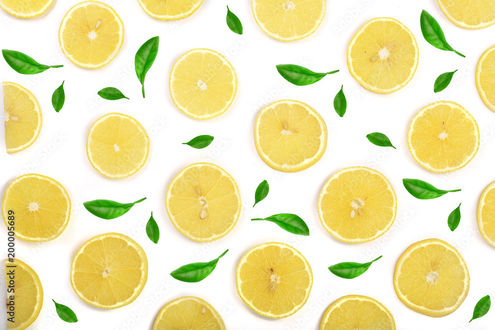 Slices lemon decorated with green leaves isolated on white background. Flat lay, top view