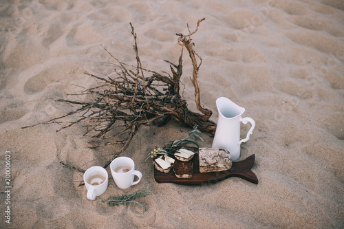 romantic breakfast for two on the sandy beach photo