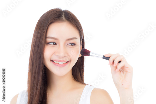 Beauty asian woman applying make up with brush of cheek isolated on white background  beautiful of girl holding blusher  skincare and cosmetic concept.