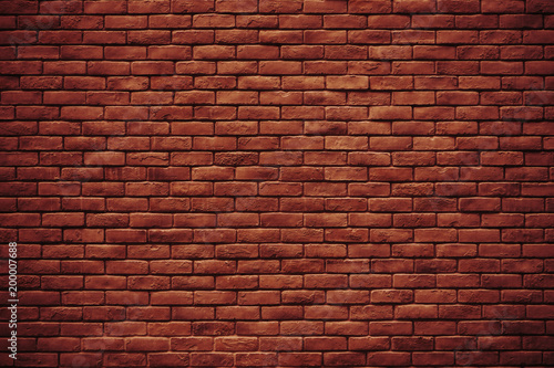 The texture of red wall made of bricks use for background