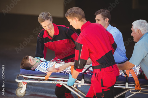 Paramedics rushing a patient in emergency
