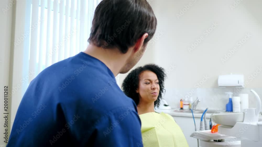 Man dentist and his pacient in private practice. Man dentist and his pacient in private practice.
