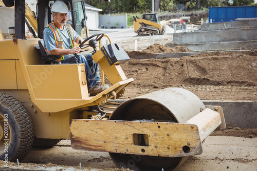 Man operating road roller photo