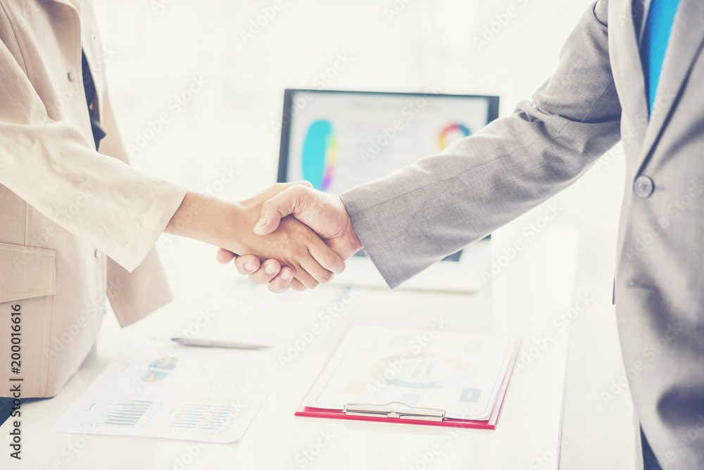business man shaking hands during a meeting in the office, success, dealing, greeting and partner concept. business man shaking hands during a meeting in the office, success, dealing, greeting and partner concept.