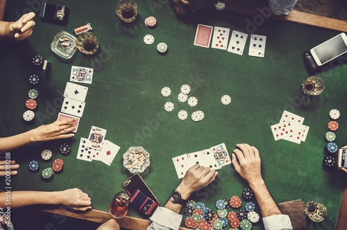 Group of people playing gambling together photo