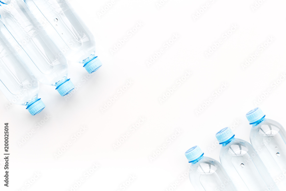 Drinking water in bottles on white background top view copy space Drinking water in bottles on white background top view copy space