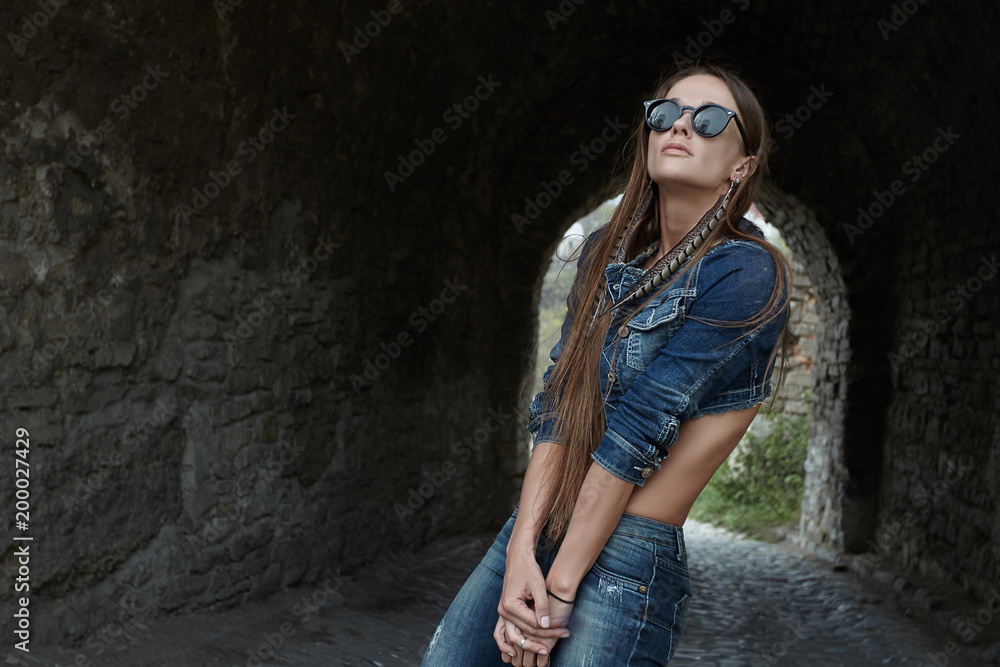 Portrait of a beautiful, fashionable woman, girl, model in the old city. Fashion, style, beauty, the old city. Portrait of a beautiful, fashionable woman, girl, model in the old city. Fashion, style, beauty, the old city.