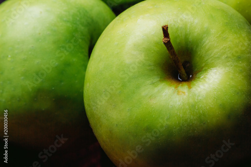 Green ripe apple close-up