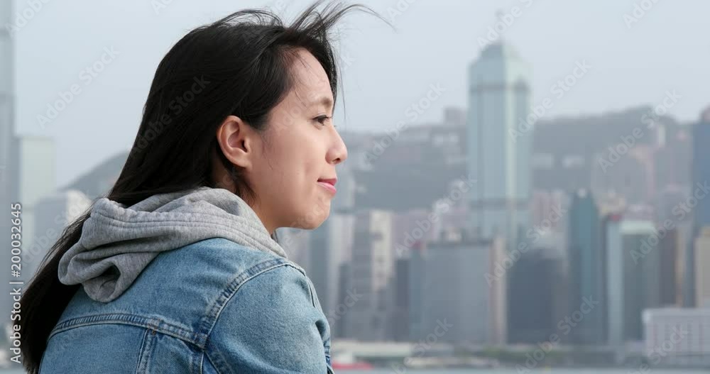 Woman looking at the sea in Hong Kong Woman looking at the sea in Hong Kong