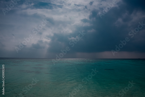 Tropical sea with cloudy sky