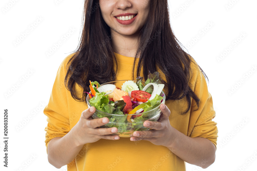 Portrait of  beautiful asian young  woman eating vegetable salad Isolated on white background.