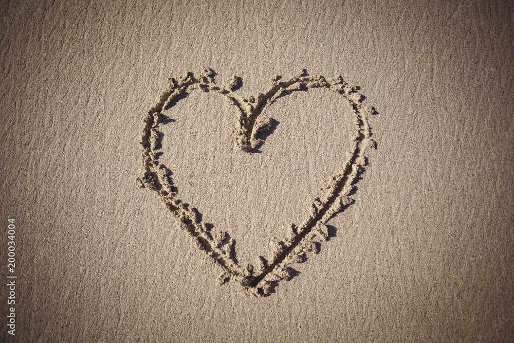 Heart drawn on sand