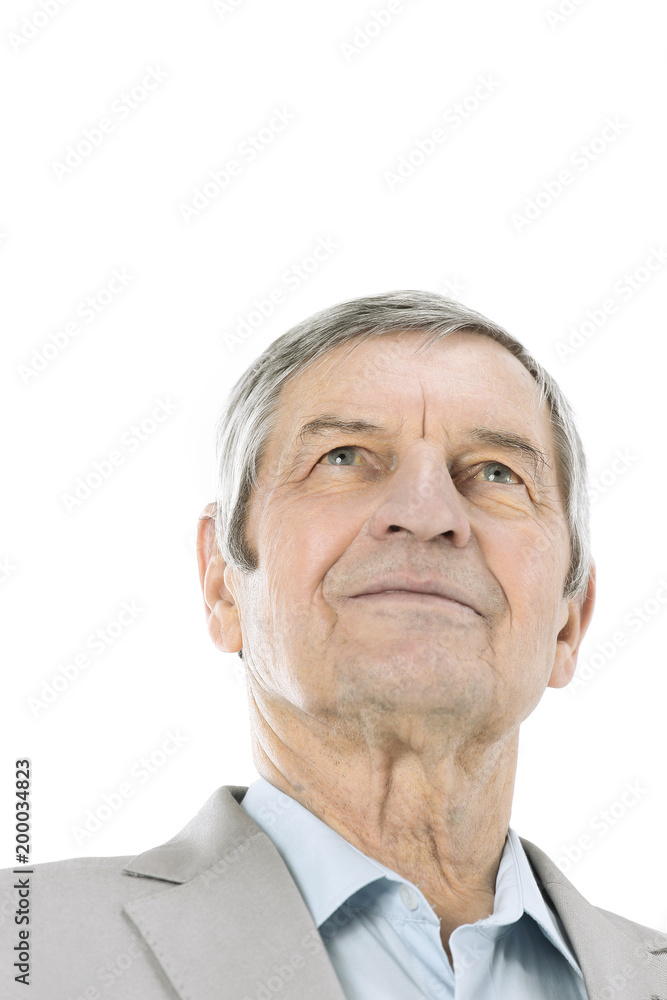 closeup.confident senior businessman looking up at copy space closeup.confident senior businessman looking up at copy space