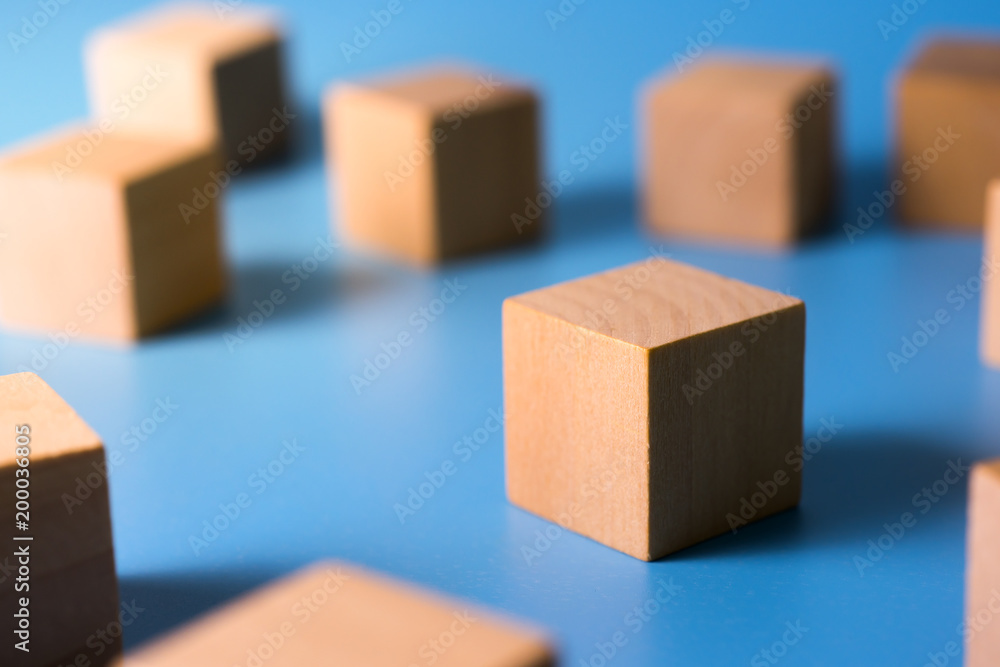 Cube wood blocks on blue