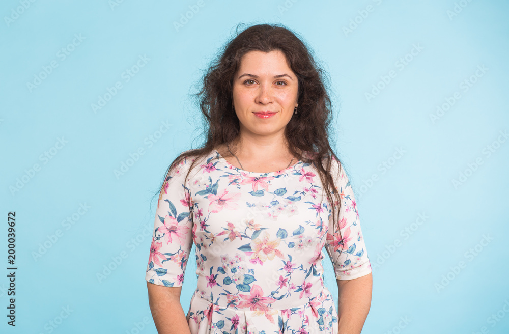 Young woman with curly hair wearing white dress Young woman with curly hair wearing white dress