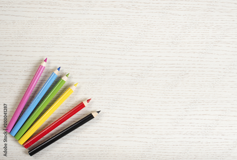 Crayons on white plank Crayons on white plank