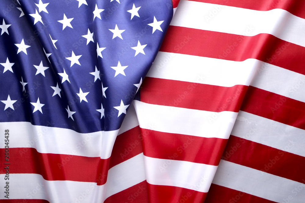 Close up of ruffled American flag. Patriots day, memorial weekend, veterans day, presidents day, independence day background. United States of America national stars and stripes symbol. Copy space.