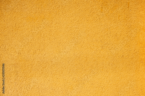 The texture of the wall is bright yellow. Abstract background.