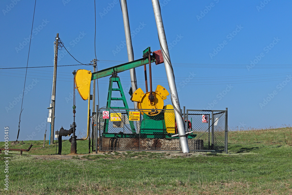 Fototapeta premium Jaszczew, Poland - april 8, 2018: Oil pump station. Tansport and distribution of oil. Technology of oil transportation system. Training manual for oil refining. Extraction of natural resources.