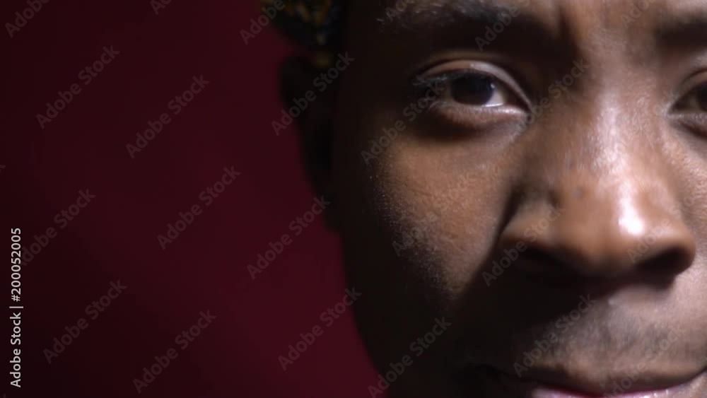 A nice man in a black bandana and looks into the camera and blinks, a portrait shooting, close up A nice man in a black bandana and looks into the camera and blinks, a portrait shooting, close up