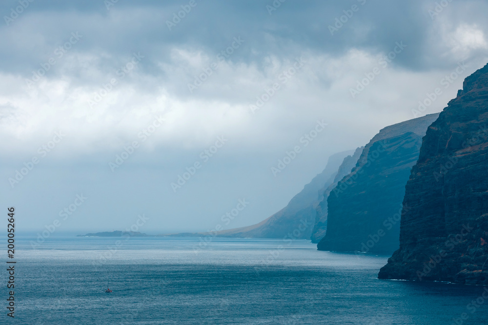 View of the cloudy cliffs of Los Gigantes in Tenerife, Canary Islands, Spain View of the cloudy cliffs of Los Gigantes in Tenerife, Canary Islands, Spain